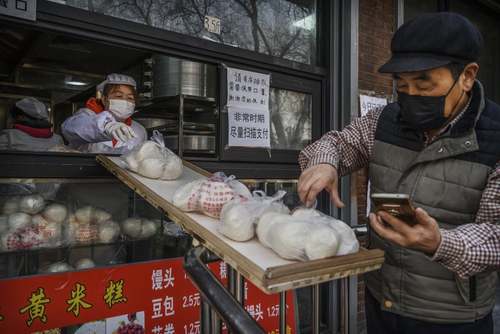 تمهیدات بهداشتی یک کلوچه فروشی در شهر پکن + عکس